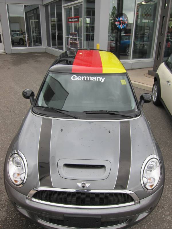 mini cooper with flag on roof