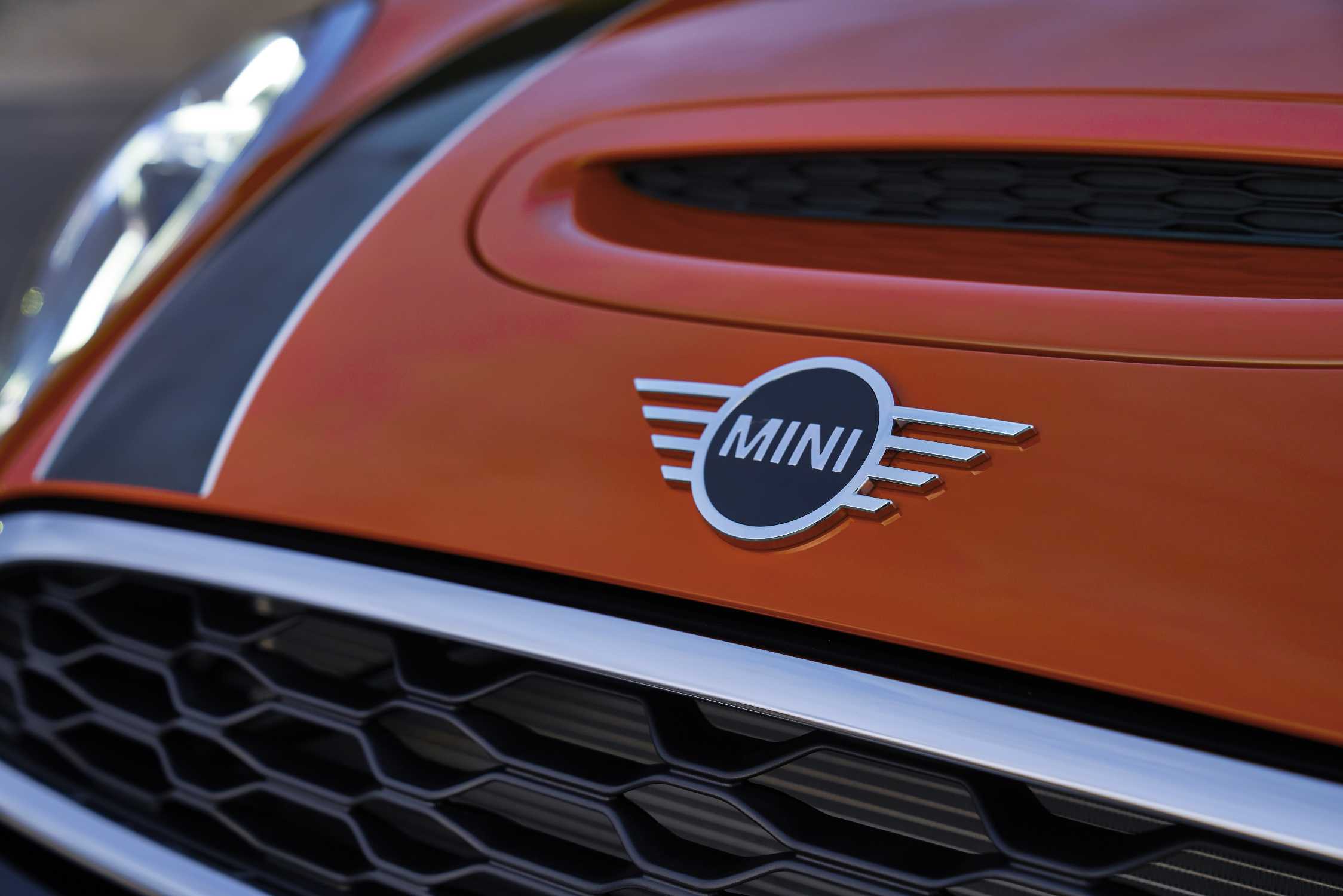 Mini Cooper Logo on Orange Car Front Parked in the Street Editorial Stock  Image - Image of mini, fast: 162207479